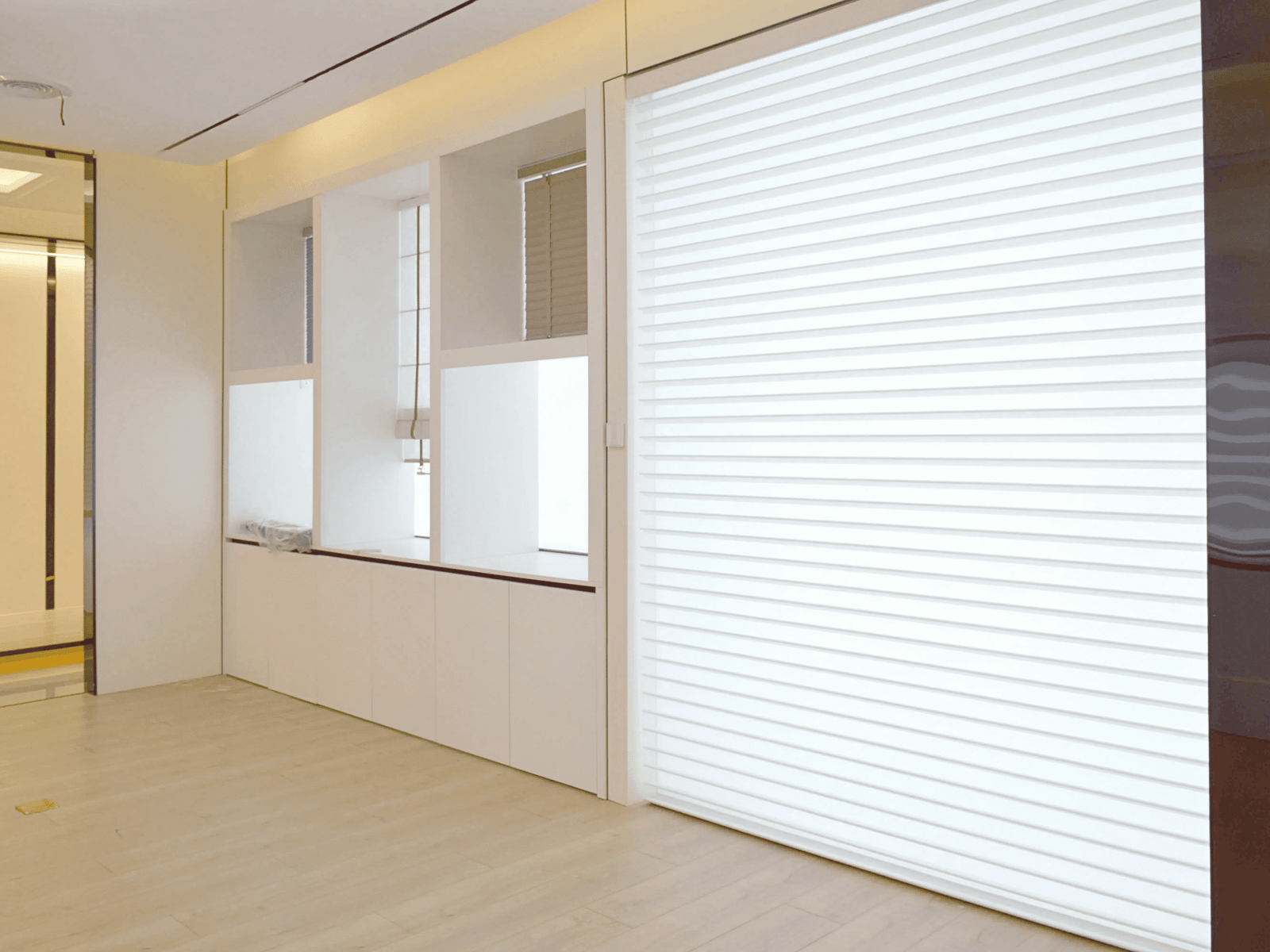 Modern interior with sleek blinds, bright room emphasizing minimalist design