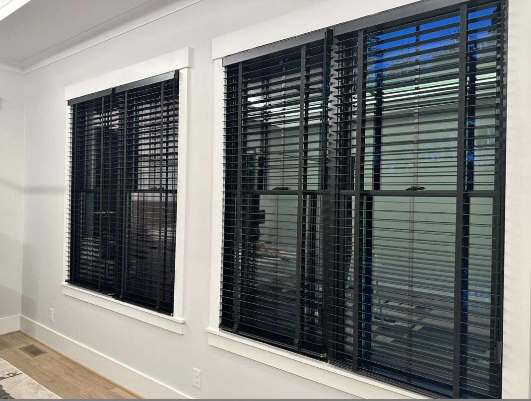 modern black blinds on white walls, creating stylish contrast