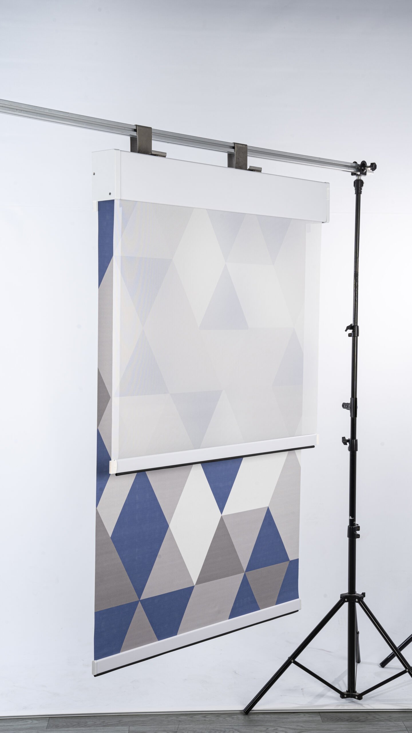Side view of geometric double roller window blind
