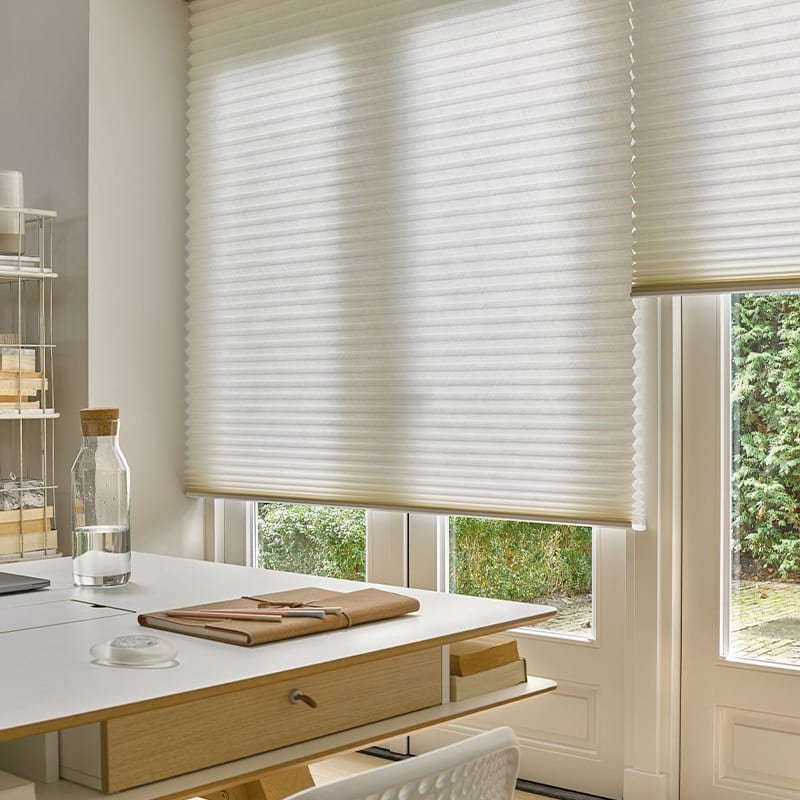 bright home office with elegant white honeycomb cellular shades