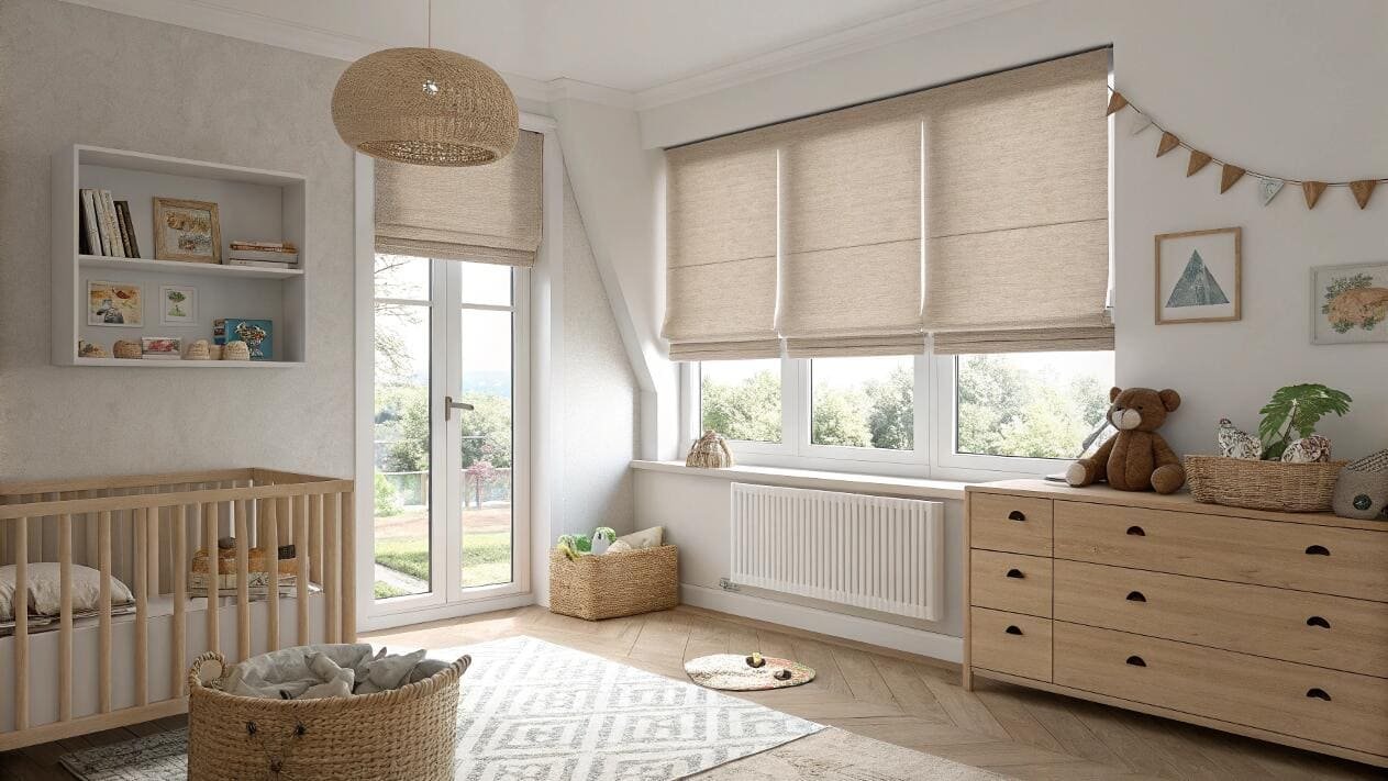 Cozy nursery with light beige roman shades on large windows