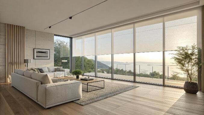 Living room with floor-to-ceiling sheer blinds and sea view