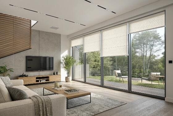 Bright living room with large sliding doors and roller blinds