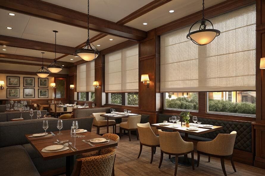 Restaurant dining area with roman shades