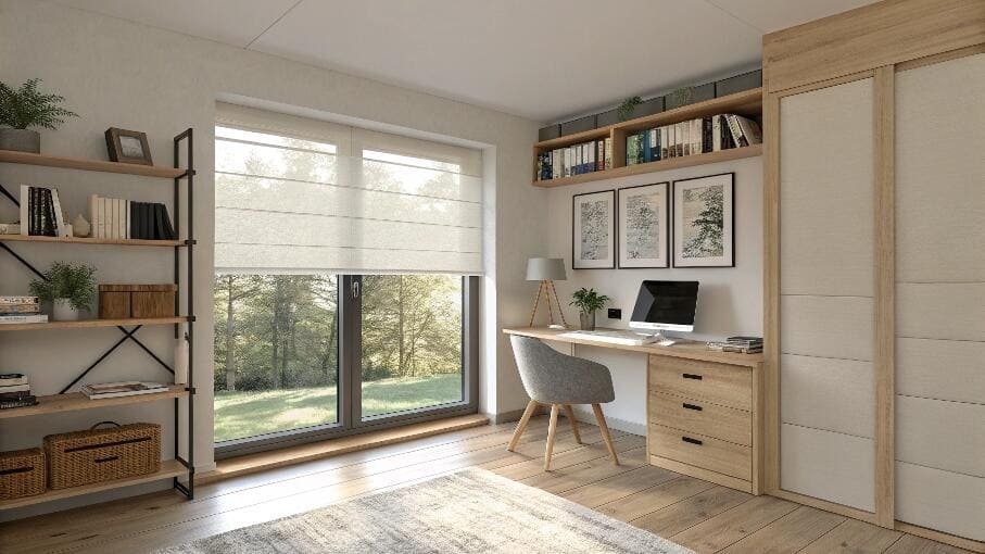 Cozy home office with a beige Roman blind overlooking a green landscape.