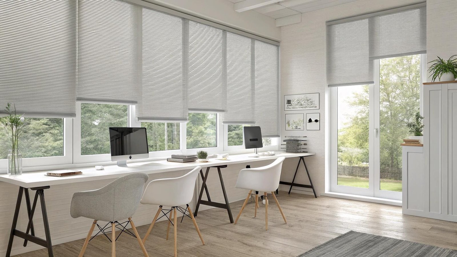 Bright modern office with multiple workstations and grey cellular shades