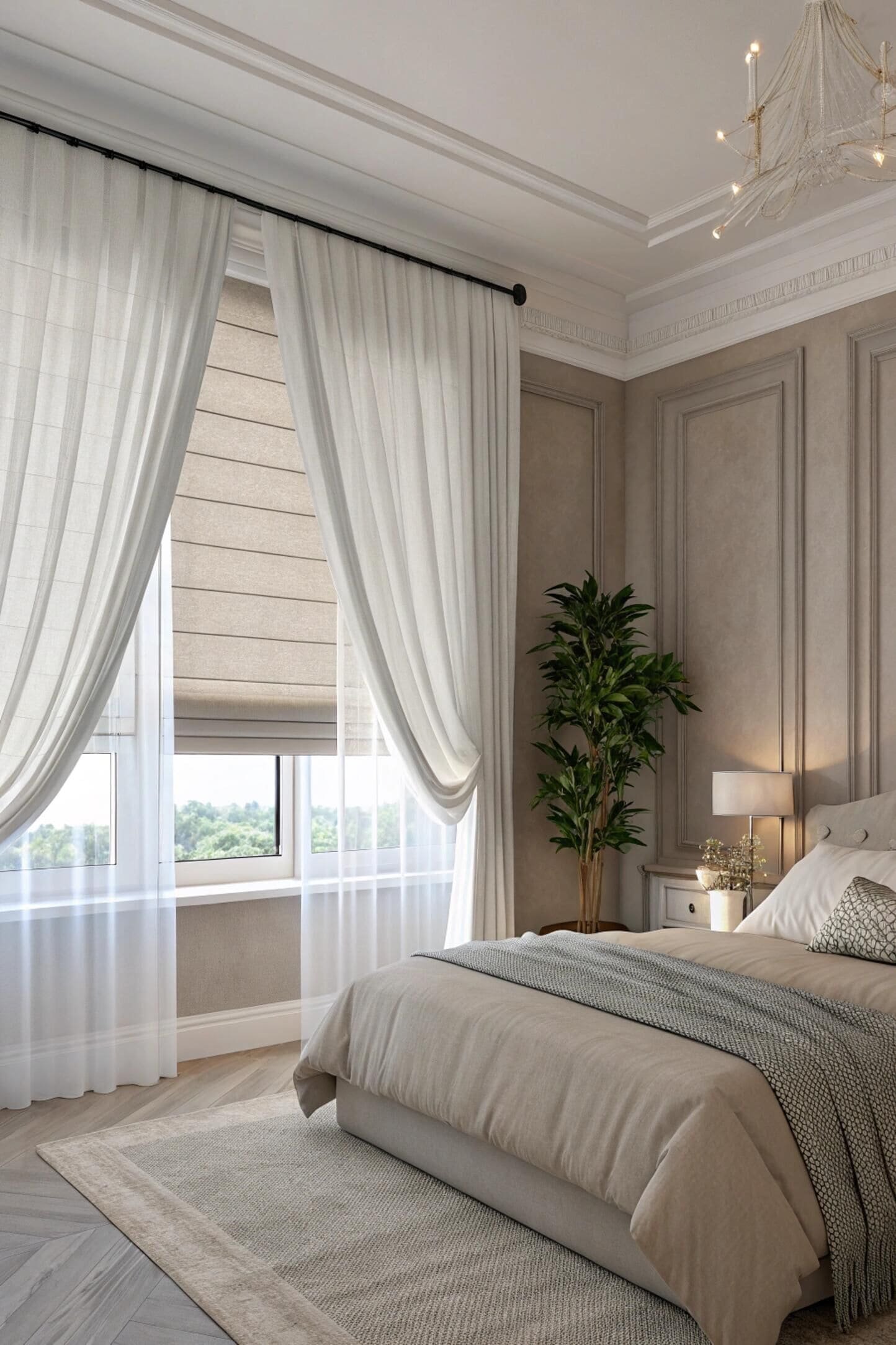 Elegant bedroom with light roman shades layered with sheer white curtains