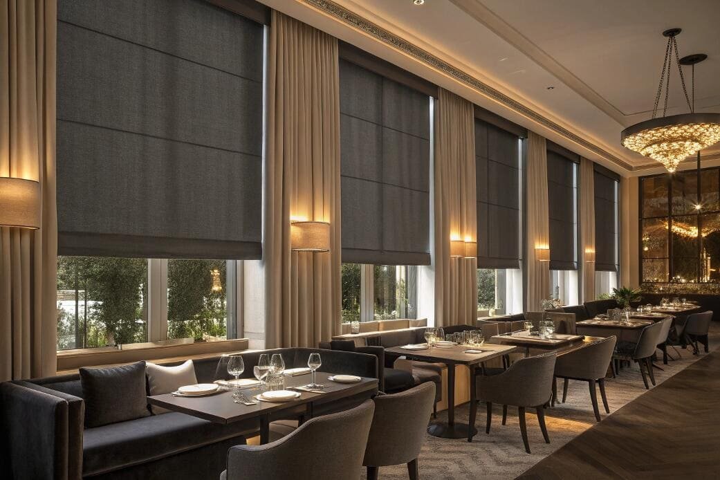 Upscale restaurant with dark blackout roller blinds
