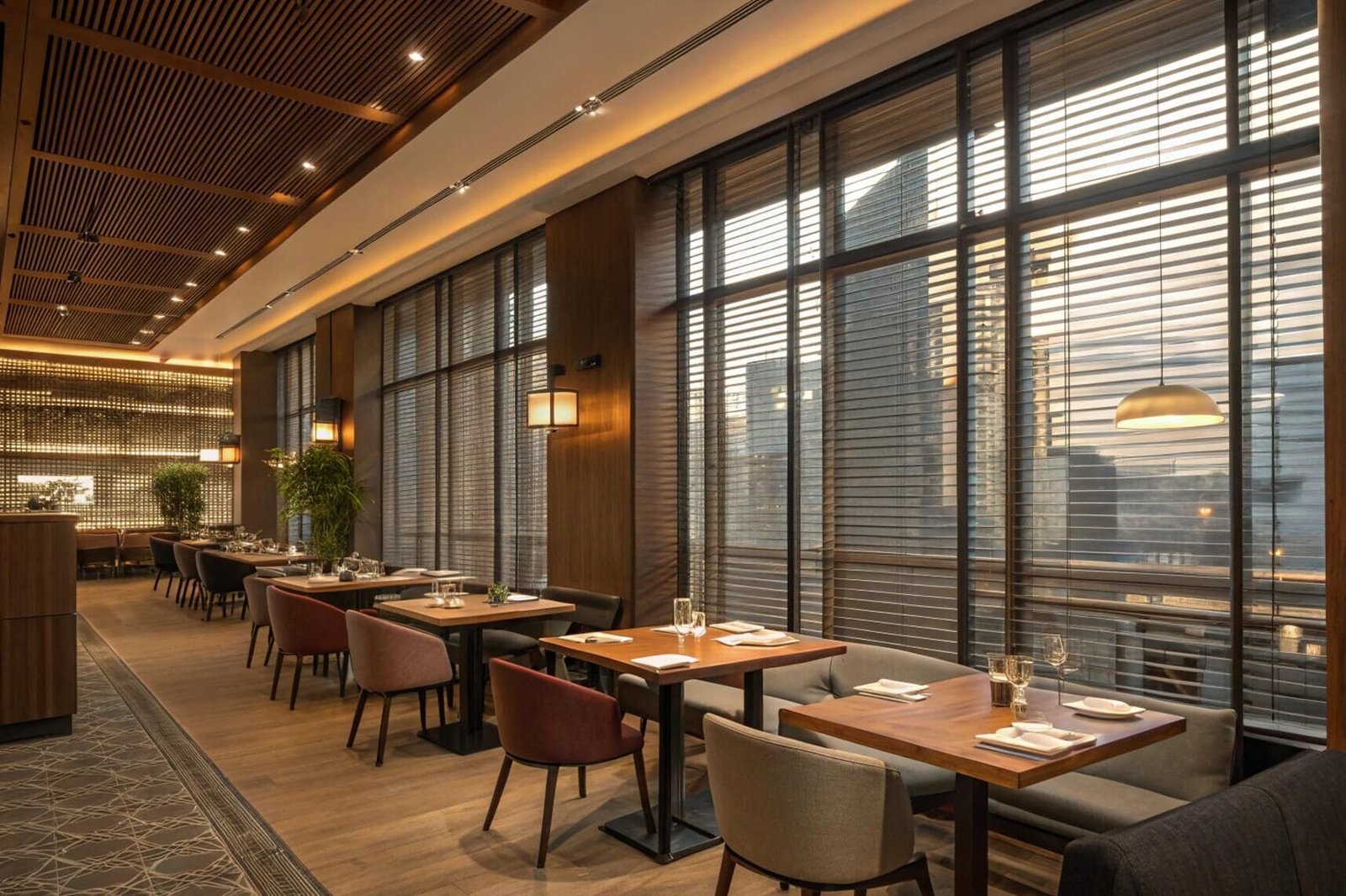 Upscale restaurant with city view and venetian blinds