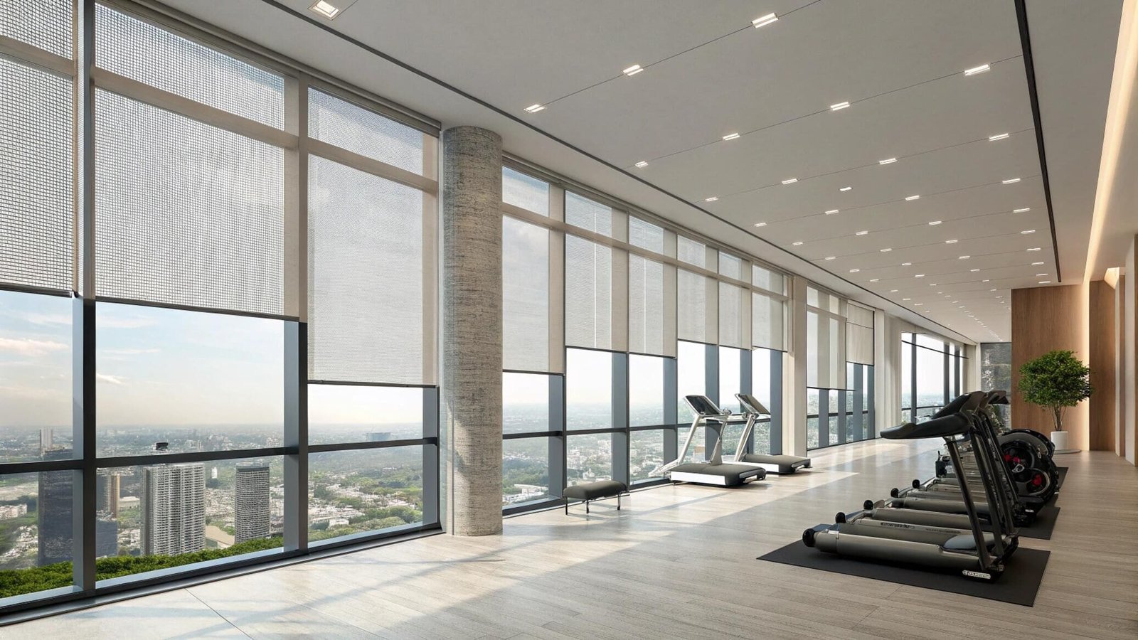 Sheer mesh roller shades in high-rise fitness gym