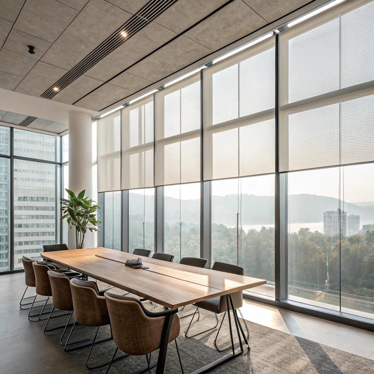 Conference room with motorized sheer roller blinds and skyline view