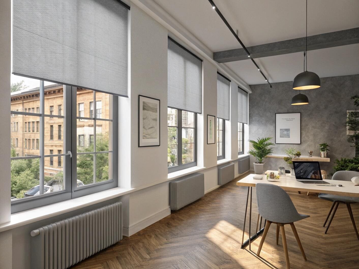 Modern office with multiple windows and grey roller shades