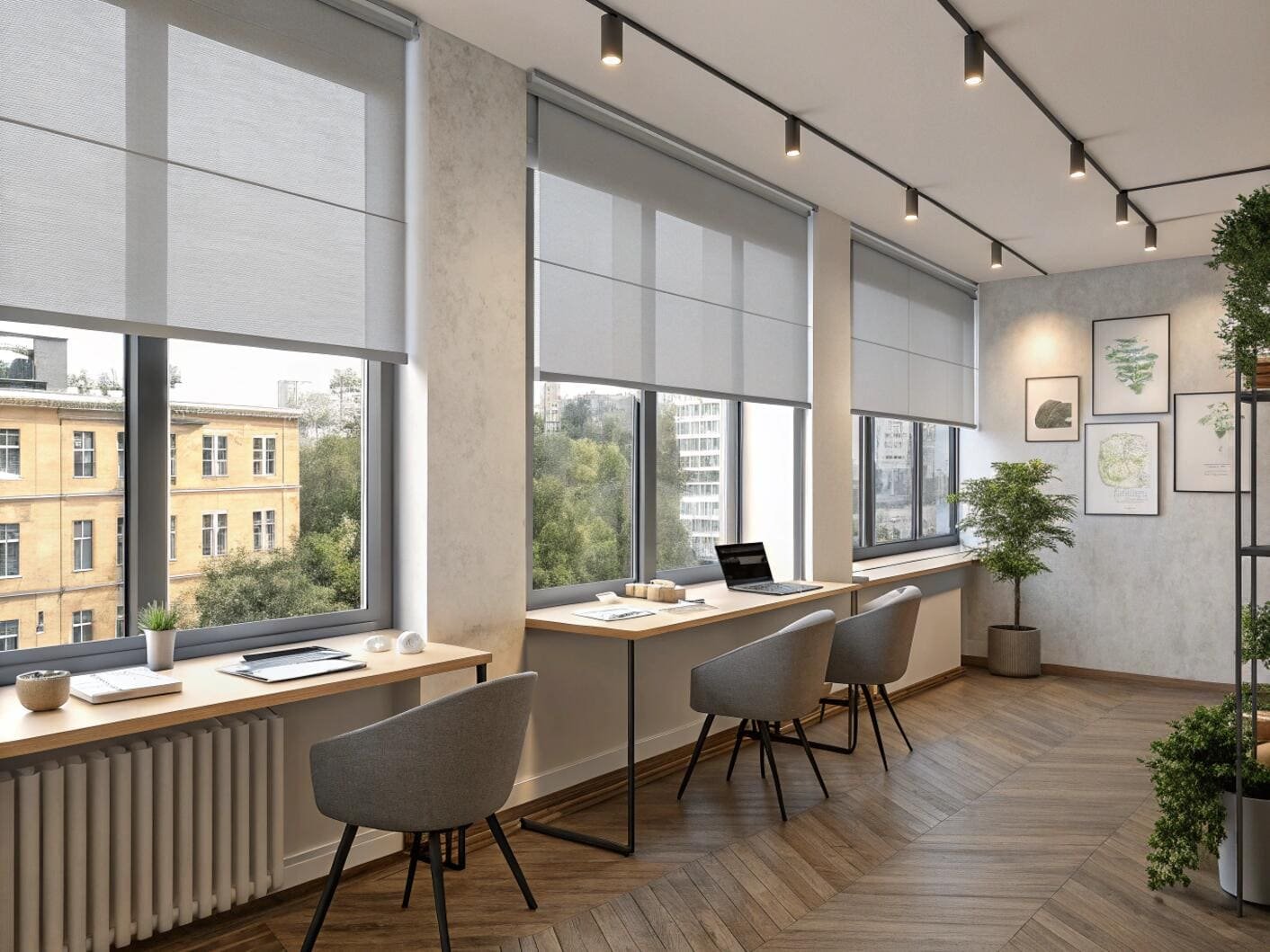 Modern office with grey roller shades and multiple desks