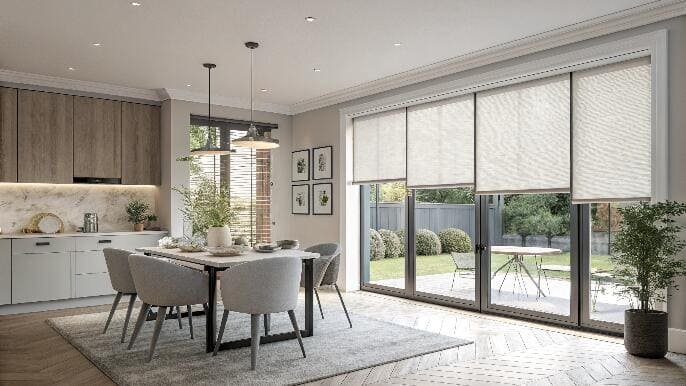Dining room with sliding glass doors and roller blinds