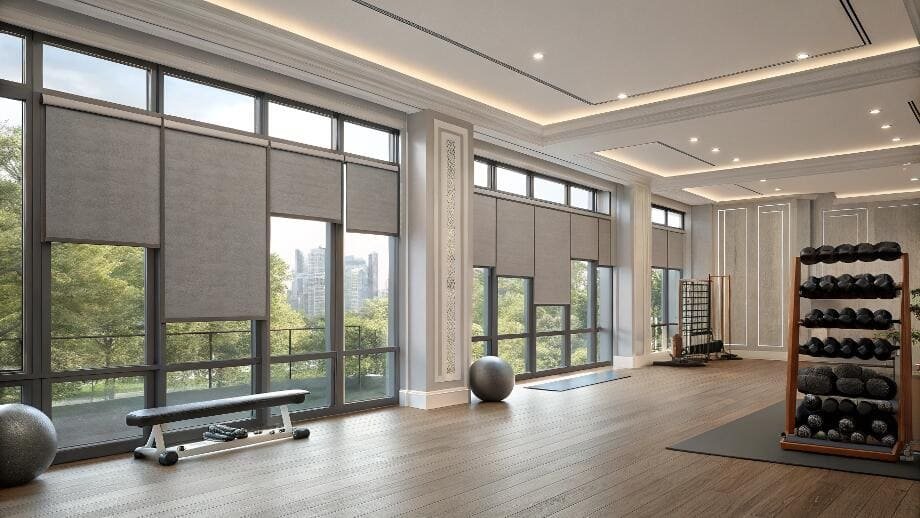 Spacious gym with modern blackout roller blinds
