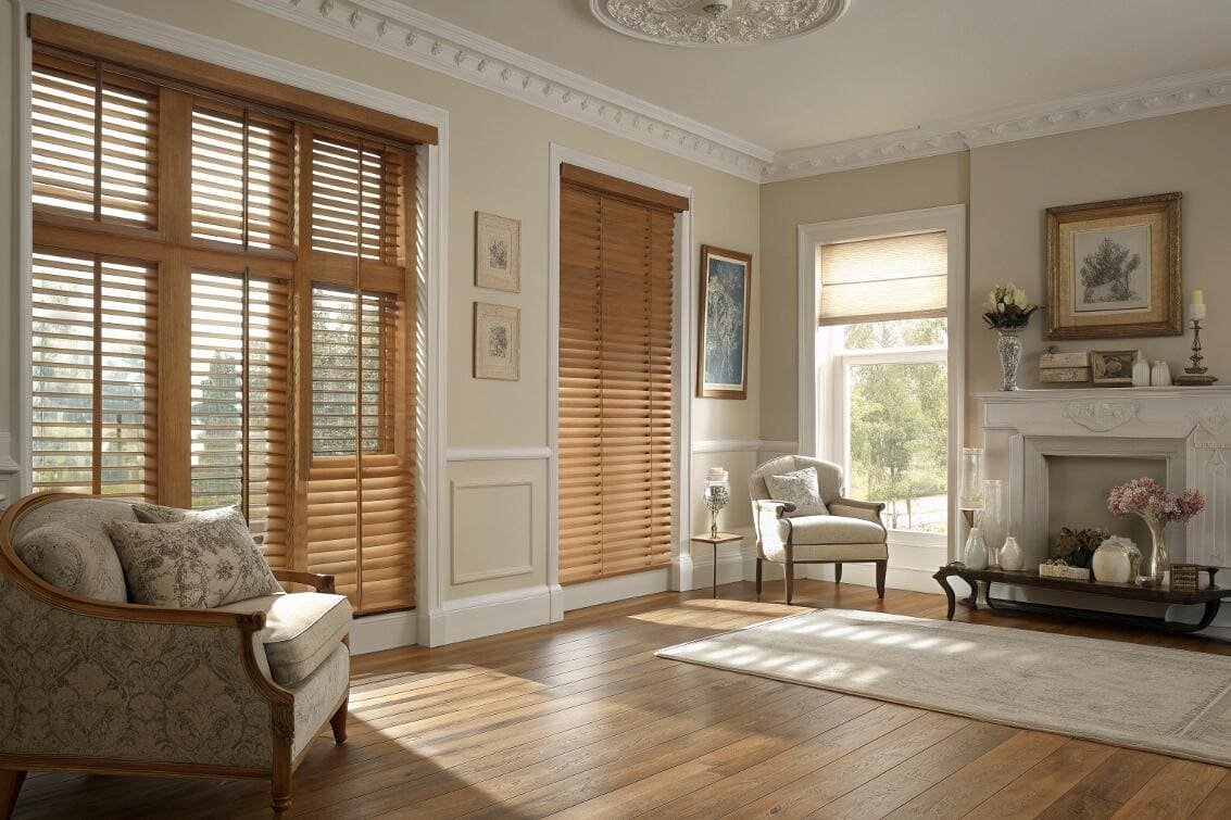 Elegant living room with warm wood venetian blinds for light control.