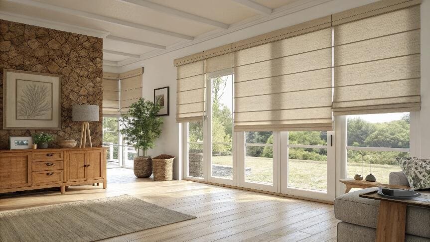 Spacious living room with natural light and elegant beige Roman blinds.