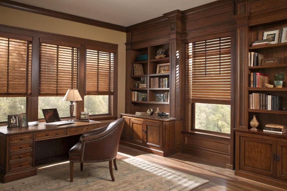 Classic wood blinds add warmth and sophisticated light control to a traditional home office.