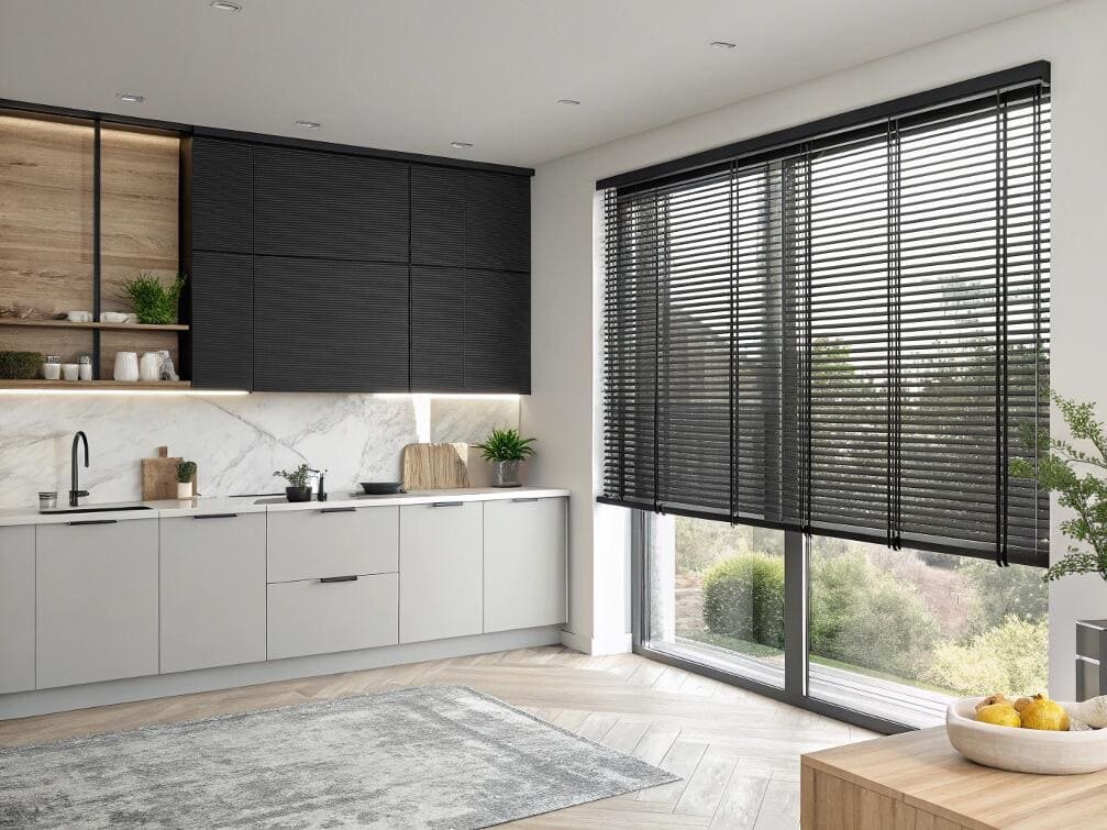 Modern kitchen with sleek black venetian blinds on tall window.