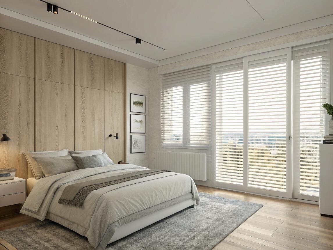 Minimalist bedroom with white Venetian blinds on a sliding glass balcony door.
