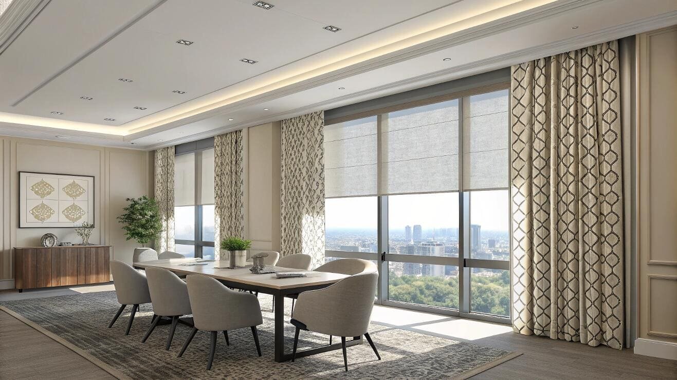 Roller shades paired with patterned drapes create a sophisticated commercial meeting space.