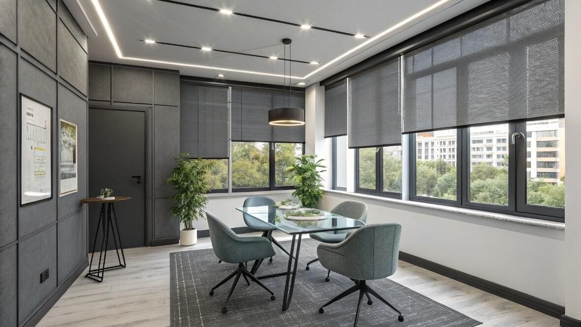 Contemporary office dining room with dark roller shades offering privacy and light control.