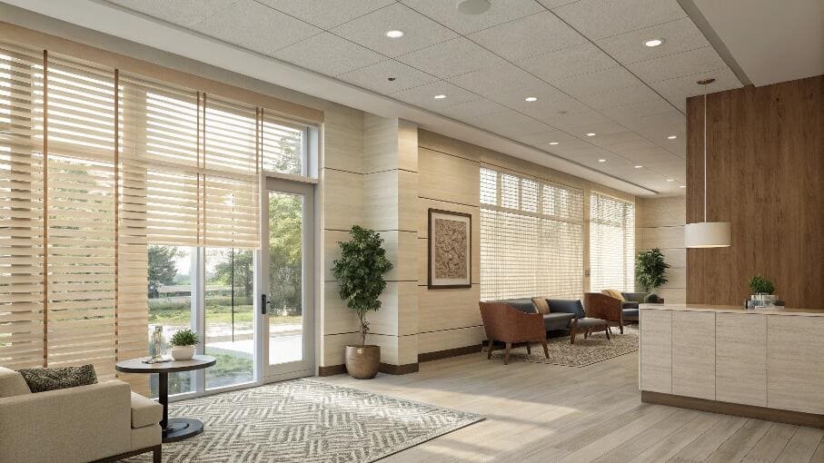 Spacious commercial lobby with elegant wood-look blinds and modern decor.