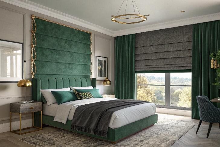 Opulent bedroom with green decor and dark Roman blinds for privacy.