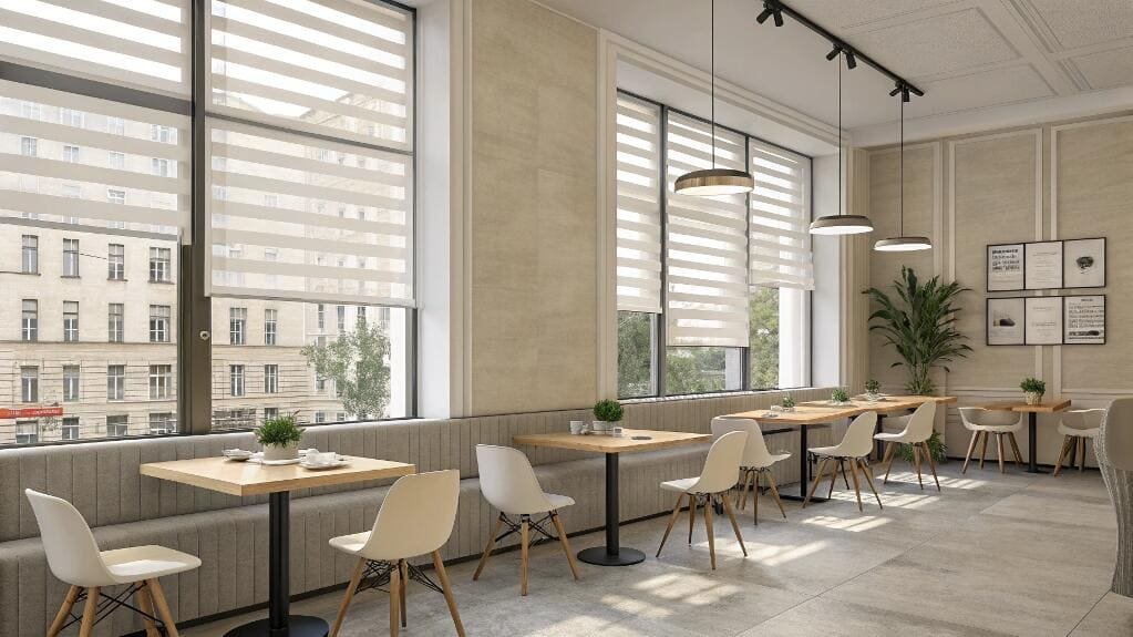 Charming cafe interior with bright windows and light-filtering zebra blinds.