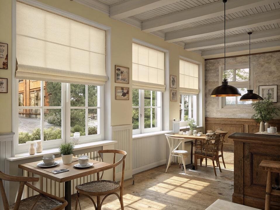 Cozy cafe featuring roman shades giving a warm, inviting atmosphere.