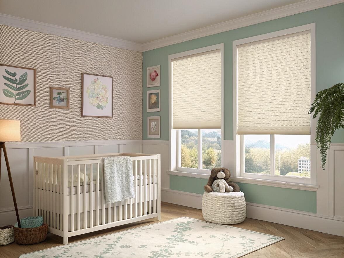 Serene nursery with cream cellular shades for gentle light control.