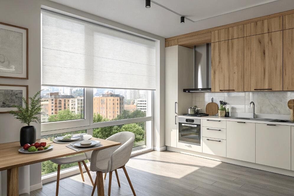 Bright modern kitchen and dining nook with a large window and a custom Roman shade.