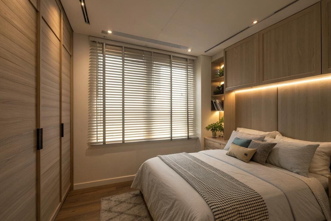 Faux wood blinds with decorative tapes offer enhanced privacy in a contemporary bedroom.