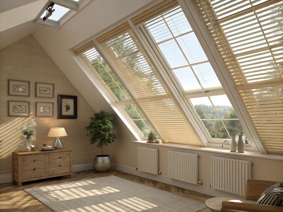 Custom-fit cellular blinds offer an effective insulation solution for angled skylight windows.