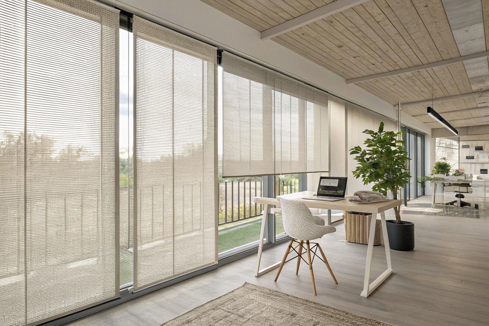 Woven panel track blinds offer a sophisticated solution for an office's sliding glass doors.