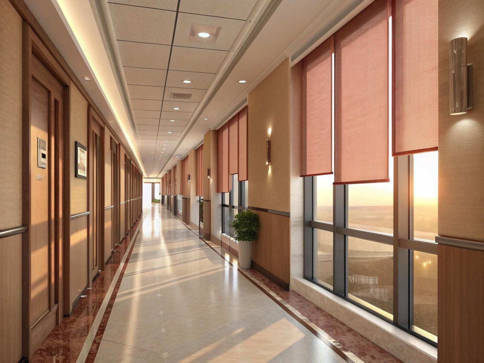 Commercial roller shades provide coordinated light management for a modern hotel or office hallway.